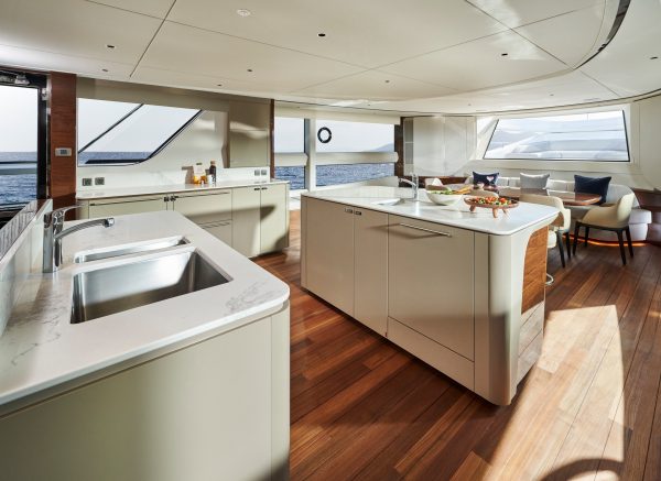 Princess X95 interior open main deck galley and dining area