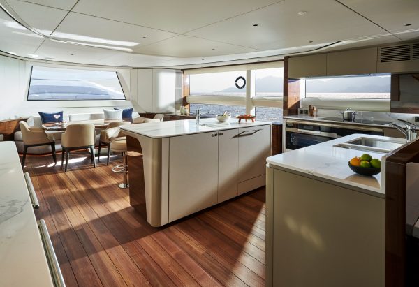 Princess X95 interior-open main deck galley and dining area